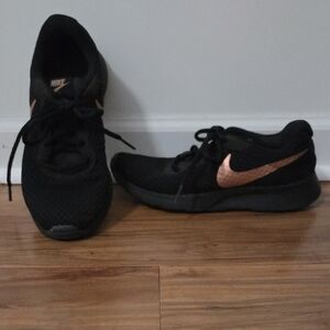 Nike Women's Black Sneakers with Gold Swoosh